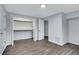 Spacious bedroom showcasing wood floors, closet with open shelving, and neutral walls at 2497 Wawona Ne Dr, Brookhaven, GA 30319