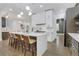 Open concept kitchen with quartz countertops, stainless appliances, and seating at the island at 2497 Wawona Ne Dr, Brookhaven, GA 30319