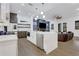 Open kitchen featuring an island, stainless appliances, and seamless flow to the living area at 2497 Wawona Ne Dr, Brookhaven, GA 30319