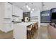 Bright kitchen with stainless steel appliances, quartz countertop island with seating, and custom cabinets at 2497 Wawona Ne Dr, Brookhaven, GA 30319