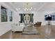 Elegant living room featuring modern lighting and hardwood floors at 2497 Wawona Ne Dr, Brookhaven, GA 30319