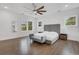 Spacious main bedroom with hardwood floors, large windows, and stylish gray accents at 2497 Wawona Ne Dr, Brookhaven, GA 30319
