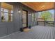 Welcoming covered front porch with stylish lanterns and wood ceiling at 2497 Wawona Ne Dr, Brookhaven, GA 30319