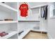 Organized walk-in closet with custom shelving and hanging rods at 2497 Wawona Ne Dr, Brookhaven, GA 30319