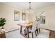 Elegant dining room featuring a wood table, upholstered chairs, and a chandelier, perfect for gatherings at 2519 Lauderdale Ne Dr, Atlanta, GA 30345