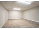 Spacious basement with carpet and neutral paint, perfect for recreation or storage at 6265 Stoney Cv, Austell, GA 30168