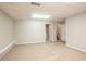 Spacious basement with carpet, neutral paint, and open layout for versatile use at 6265 Stoney Cv, Austell, GA 30168