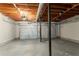 Unfinished basement featuring a dual garage door, and painted concrete floors at 6265 Stoney Cv, Austell, GA 30168