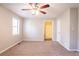 Comfortable bedroom with a ceiling fan and doorway to a bathroom or closet at 6265 Stoney Cv, Austell, GA 30168