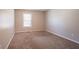 Clean and simple bedroom with neutral carpet, providing a blank canvas for personalization at 6265 Stoney Cv, Austell, GA 30168