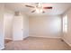 Bedroom featuring carpet, a ceiling fan, and a window for natural light at 6265 Stoney Cv, Austell, GA 30168