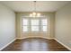 Bright dining room with bay windows, ideal for enjoying natural light and scenic views at 6265 Stoney Cv, Austell, GA 30168