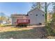 Side view of home with a deck and gray siding at 6265 Stoney Cv, Austell, GA 30168