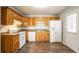 Bright kitchen featuring wooden cabinets, modern appliances, and hardwood floors at 6265 Stoney Cv, Austell, GA 30168