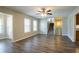 Open living room featuring hardwood floors, stairs to second story and natural light at 6265 Stoney Cv, Austell, GA 30168