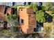 Aerial view of a house with a brown roof, surrounded by trees at 838 Lake Hollow Sw Blvd, Marietta, GA 30064