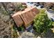 Aerial view of a house with a brown roof and surrounded by nature at 838 Lake Hollow Sw Blvd, Marietta, GA 30064