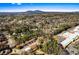 Aerial view of property surrounded by trees and homes in a neighborhood at 838 Lake Hollow Sw Blvd, Marietta, GA 30064