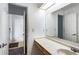 Bathroom features a vanity with an integrated countertop and an entrance to another room at 838 Lake Hollow Sw Blvd, Marietta, GA 30064