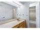 Bright bathroom featuring a long vanity, a large mirror, and a separate shower and toilet area at 838 Lake Hollow Sw Blvd, Marietta, GA 30064