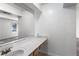 Bathroom features a large mirror and vanity with a sink at 838 Lake Hollow Sw Blvd, Marietta, GA 30064