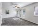 Large bedroom features multiple windows, a ceiling fan, and a door to the outside at 838 Lake Hollow Sw Blvd, Marietta, GA 30064
