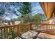 View of the wooden deck overlooking mature trees and a serene setting at 838 Lake Hollow Sw Blvd, Marietta, GA 30064