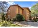 Charming two-story home with a vertical wood plank exterior and a lush green lawn at 838 Lake Hollow Sw Blvd, Marietta, GA 30064