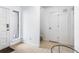 Foyer features tile flooring, a glass table and access to the front door at 838 Lake Hollow Sw Blvd, Marietta, GA 30064