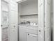 A clean, dedicated laundry room with modern machines offers convenience and efficiency at 838 Lake Hollow Sw Blvd, Marietta, GA 30064
