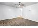 A spacious living room with a ceiling fan and neutral carpet at 838 Lake Hollow Sw Blvd, Marietta, GA 30064