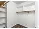 This walk-in closet features ample storage with shelving at 838 Lake Hollow Sw Blvd, Marietta, GA 30064