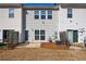 Townhouse backyard with a small patio and grass at 2873 Snapfinger Mnr, Decatur, GA 30035