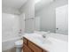 Bathroom with white tile tub/shower, toilet, ceramic tile flooring, and vanity with sink at 2873 Snapfinger Mnr, Decatur, GA 30035
