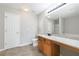 Bathroom featuring a granite counter, undermount sink, white door and ceramic tile floor at 2873 Snapfinger Mnr, Decatur, GA 30035