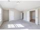 Airy bedroom featuring neutral color palette, plush carpet, and multiple entryways at 2873 Snapfinger Mnr, Decatur, GA 30035