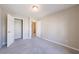 Bedroom with carpeting, neutral paint and two white doors at 2873 Snapfinger Mnr, Decatur, GA 30035