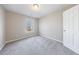 Neutral bedroom with a window, carpeting, and white door at 2873 Snapfinger Mnr, Decatur, GA 30035