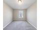 Clean bedroom with a single window letting in natural light at 2873 Snapfinger Mnr, Decatur, GA 30035