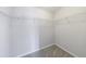 Walk-in closet featuring wire shelving and neutral carpeting at 2873 Snapfinger Mnr, Decatur, GA 30035