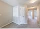 Hallway upstairs has carpet flooring and three doors at 2873 Snapfinger Mnr, Decatur, GA 30035