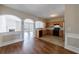 Well-lit kitchen with tile flooring, ample cabinet space, and a view to the fireplace in the living area at 2873 Snapfinger Mnr, Decatur, GA 30035