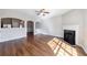 Living room has wood flooring, fireplace, arched doorways, and a view into the kitchen at 2873 Snapfinger Mnr, Decatur, GA 30035