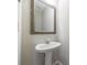 Pedestal sink and decorative mirror in half bath at 2873 Snapfinger Mnr, Decatur, GA 30035