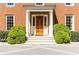 Inviting front entrance with white columns and lush landscaping at 2980 Bakers Meadow Se Ln, Atlanta, GA 30339