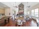 Community clubhouse with a stone fireplace, multiple ceiling fans, and hardwood flooring at 307 Serenity Way, Woodstock, GA 30188