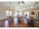 Open clubhouse area featuring tables with chairs, hardwood floors, and ample natural light at 307 Serenity Way, Woodstock, GA 30188