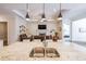Open concept kitchen with granite countertops, stainless steel sink, and views into the living room at 307 Serenity Way, Woodstock, GA 30188
