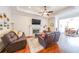 Inviting living room with a fireplace, comfortable seating, and views into the dining area at 307 Serenity Way, Woodstock, GA 30188