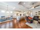 Spacious open-concept living area flows from seating to kitchen with modern appliances and countertops at 307 Serenity Way, Woodstock, GA 30188